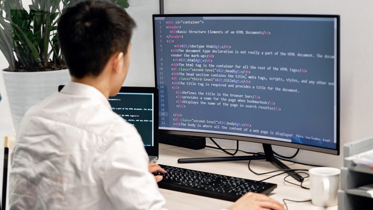 A software engineer coding on comouter.