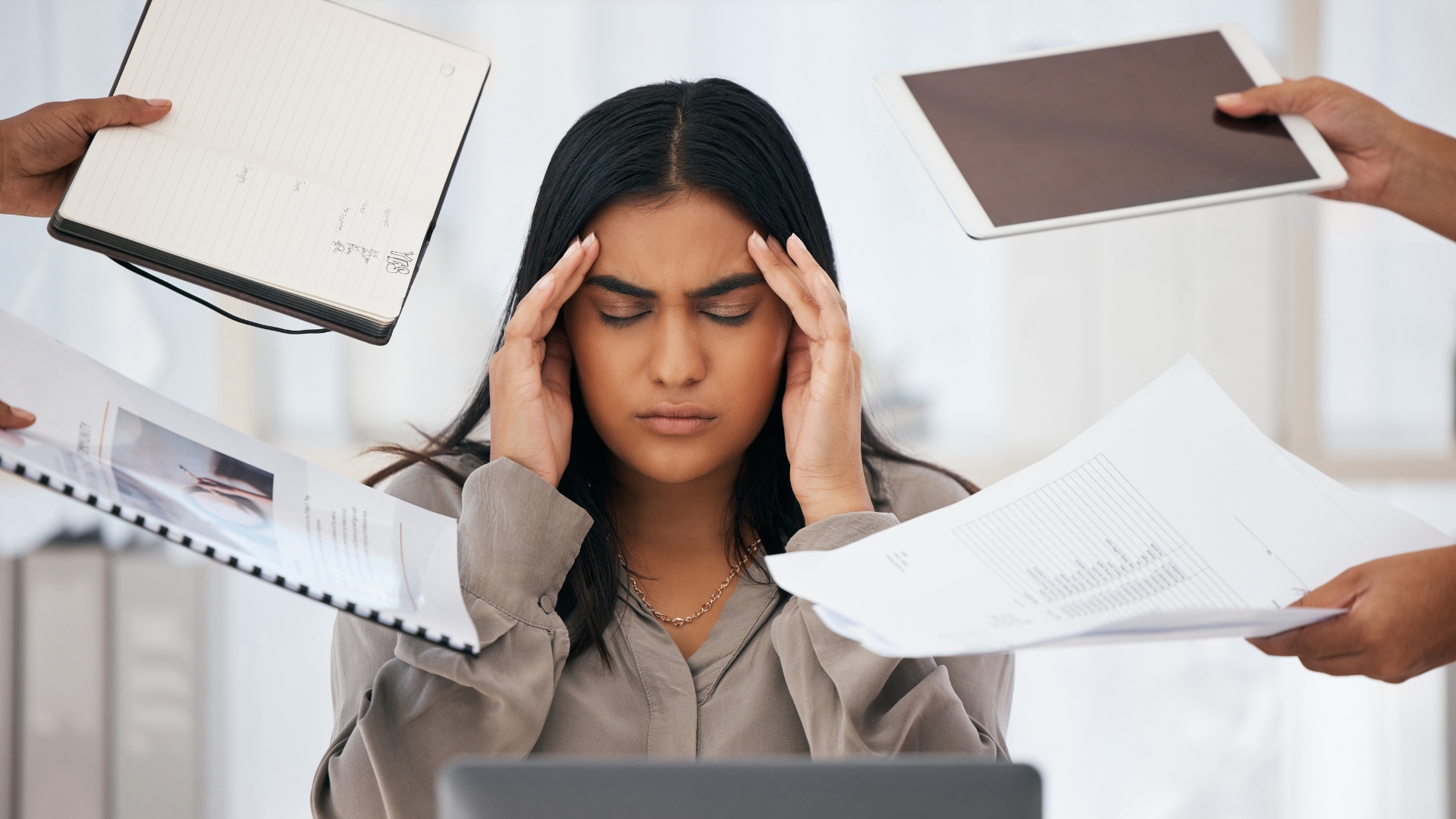 A women employee under mental stress at workplace.