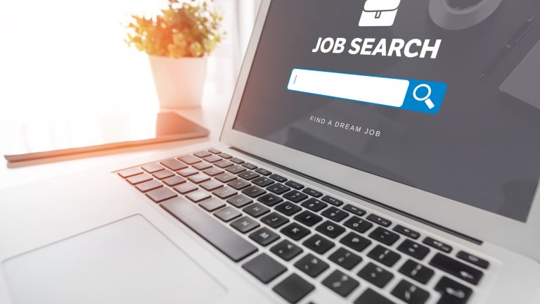 Laptop with social media website open for job searching.
